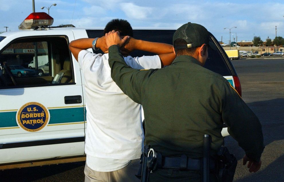 PHOTO: A person arrested for entering the United States illegally is taken to a U.S. Border Patrol truck in Calexico on the U.S.-Mexico border.