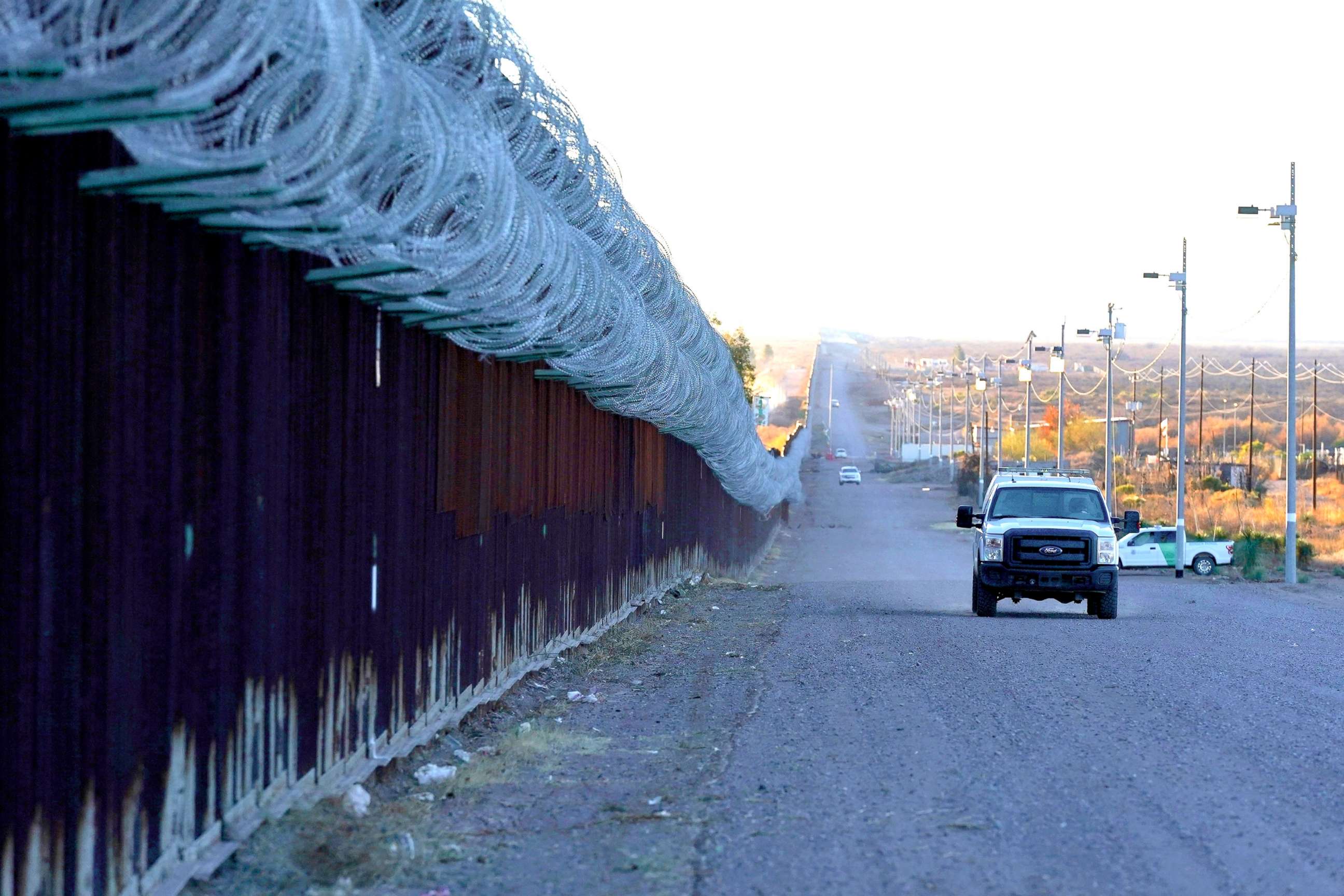 PHOTO:A U.S. Border Patrol vehicle drives along the border fence at the U.S.-Mexico border wall, on Dec. 15, 2020, in Douglas, Ariz.