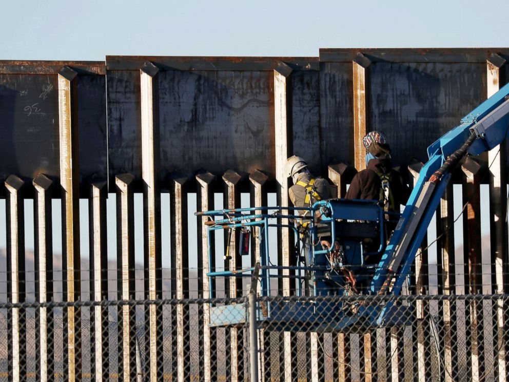 PHOTO: People work on the U.S./Mexican border wall, Feb. 12, 2019, in El Paso, Texas.