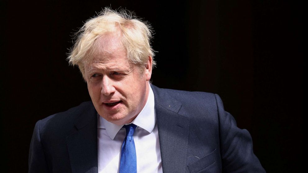 PHOTO: British Prime Minister Boris Johnson walks at Downing Street in London, July 6, 2022.