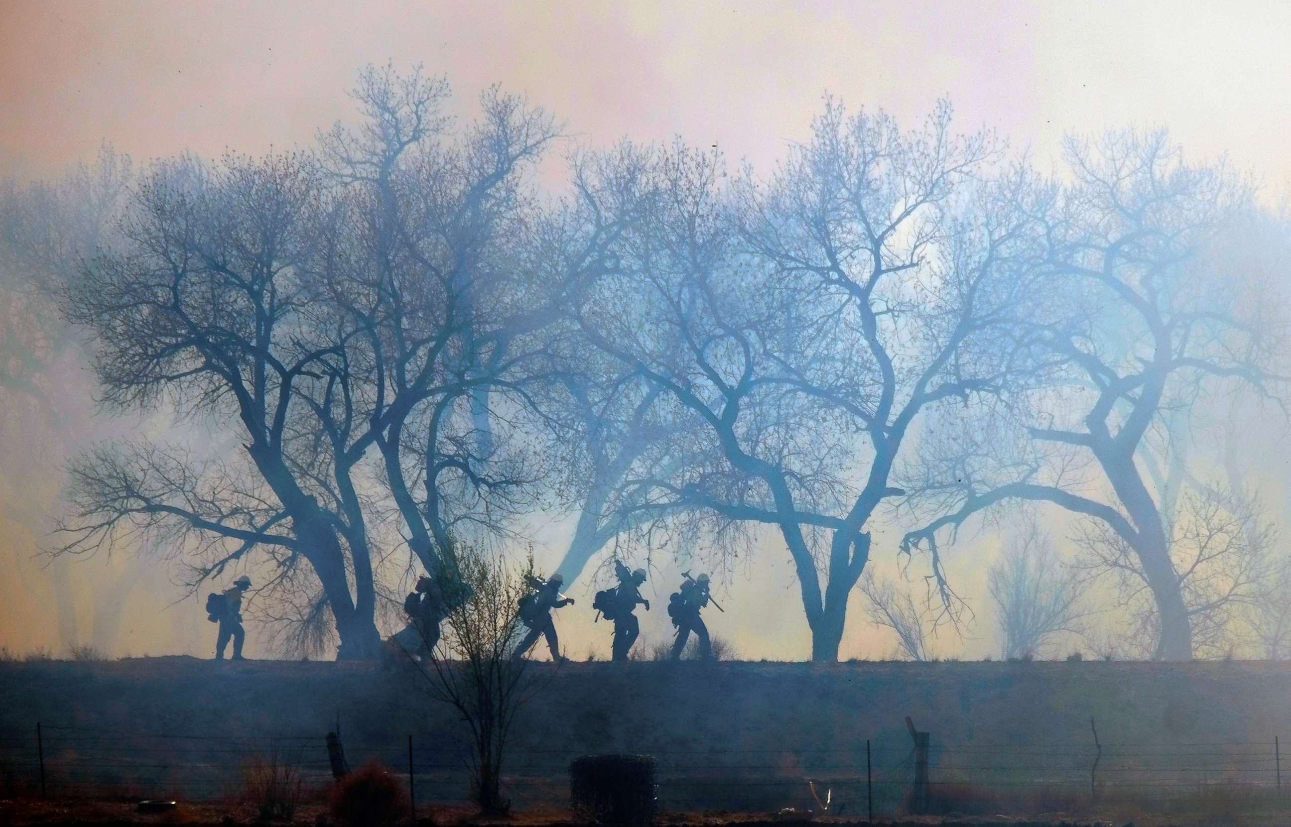 PHOTO: Fire crews work on setting up a line on the north end of the Big Hole Fire in Belen, New Mexico, April 12, 2022.