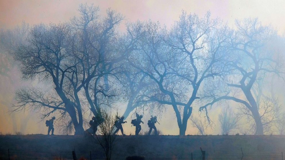 PHOTO: Fire crews work on setting up a line on the north end of the Big Hole Fire in Belen, New Mexico, April 12, 2022.