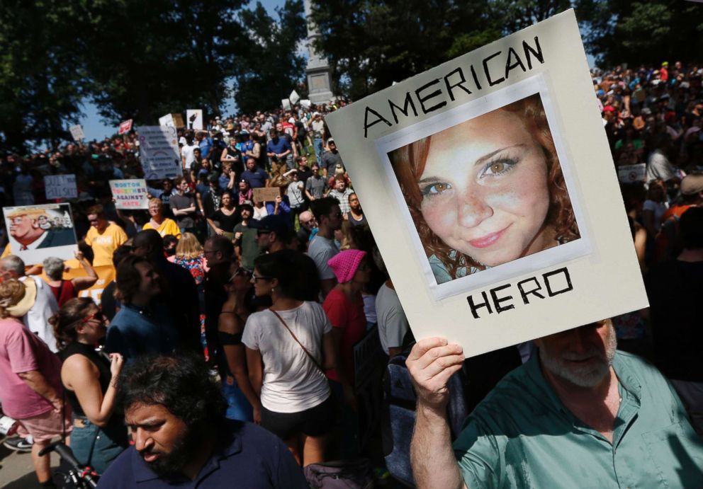 PHOTO: A counterprotester holds a photo of Heather Heyer on Boston Common at a "Free Speech" rally organized by conservative activists, Aug. 19, 2017, in Boston. 
