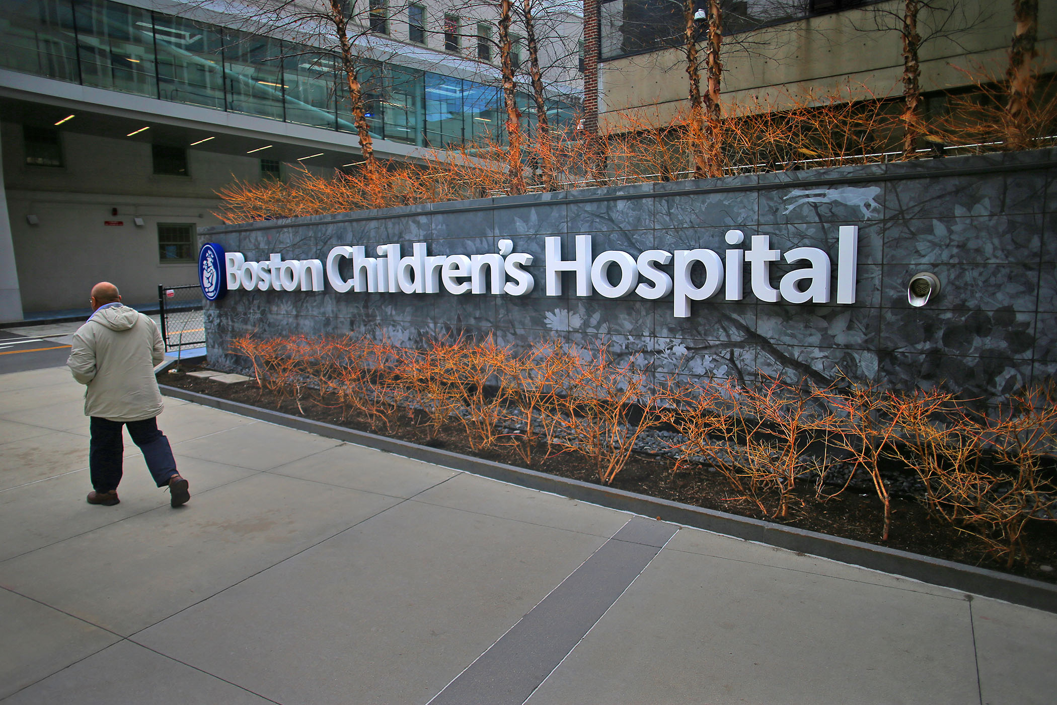 PHOTO: A pedestrian passes the Longwood Avenue exterior of the Boston Children's Hospital on Feb. 26, 2020. 