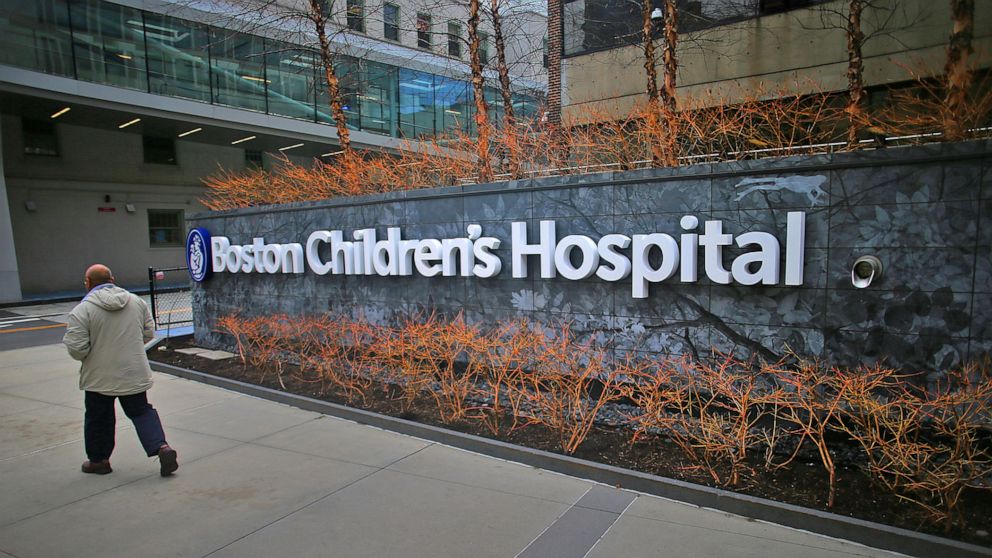 PHOTO: A pedestrian passes the Longwood Avenue exterior of the Boston Children's Hospital on Feb. 26, 2020. 
