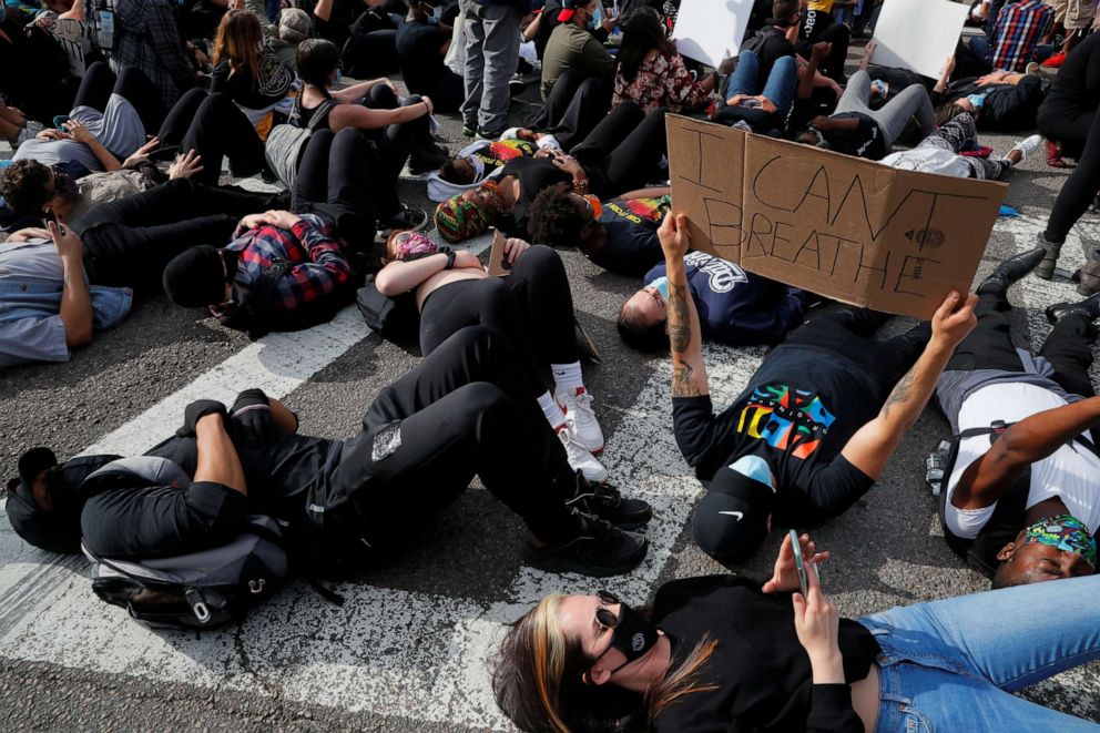 PHOTO: People take part in a "die-in" as they attend a rally following the death in Minneapolis police custody of George Floyd, in Boston, June 2, 2020.