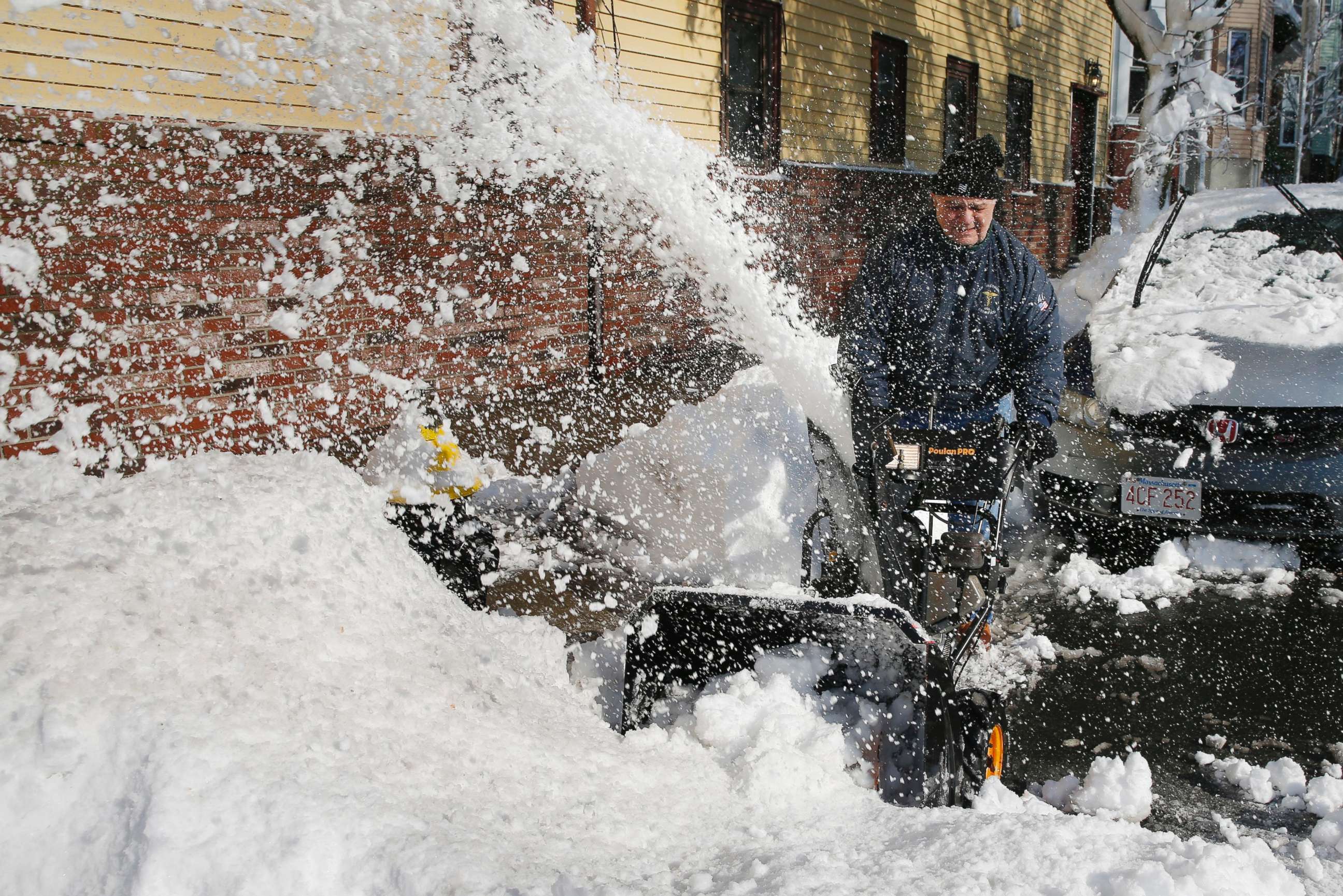 PHOTO: Al Gambale clears snow on Cottage Street in Boston, March 14, 2018. The Boston area was hit with it's third nor'easter of the month on Tuesday, a storm that brought powerful gusts of wind and over a foot of snow.