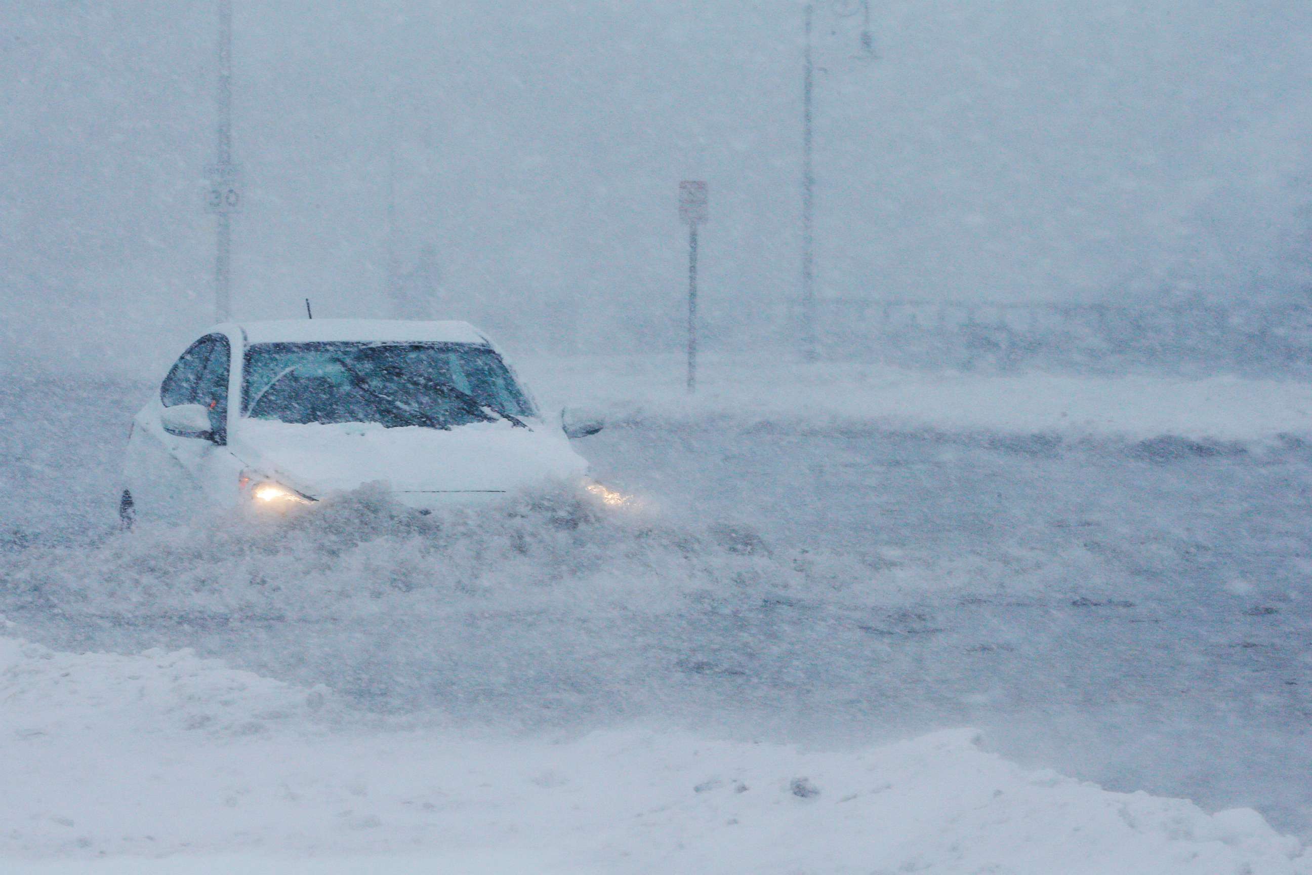 PHOTO: Drivers make their way along the flooded Beach Road after the ocean overtopped the seawall during a winter snowstorm in the Boston suburb of Lynn, Mass., Jan. 4, 2018.