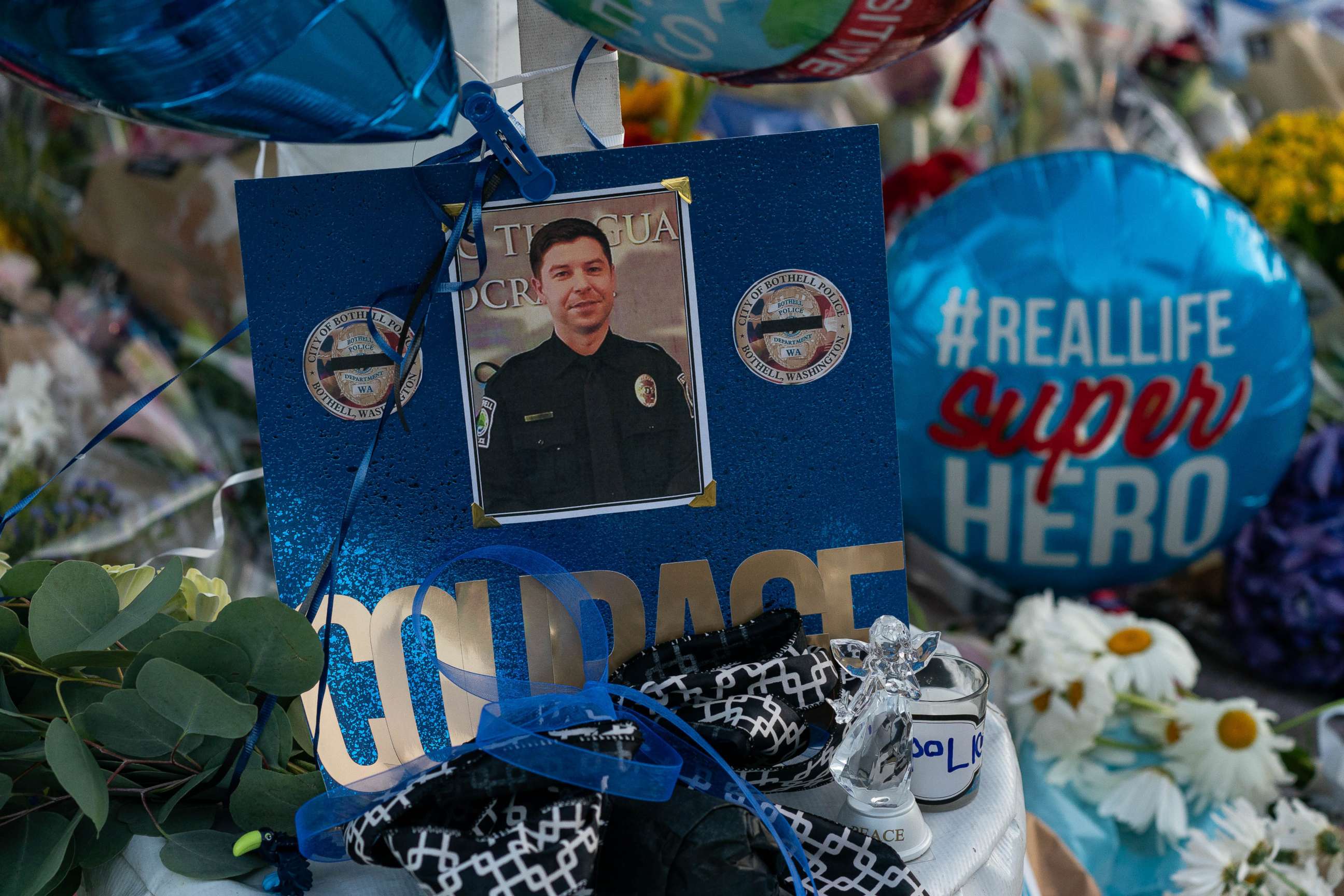 PHOTO: A photo of slain Police Officer Jonathan Shoop is shown at a memorial outside the Bothell Police Department on July 14, 2020 in Bothell, Wash. 