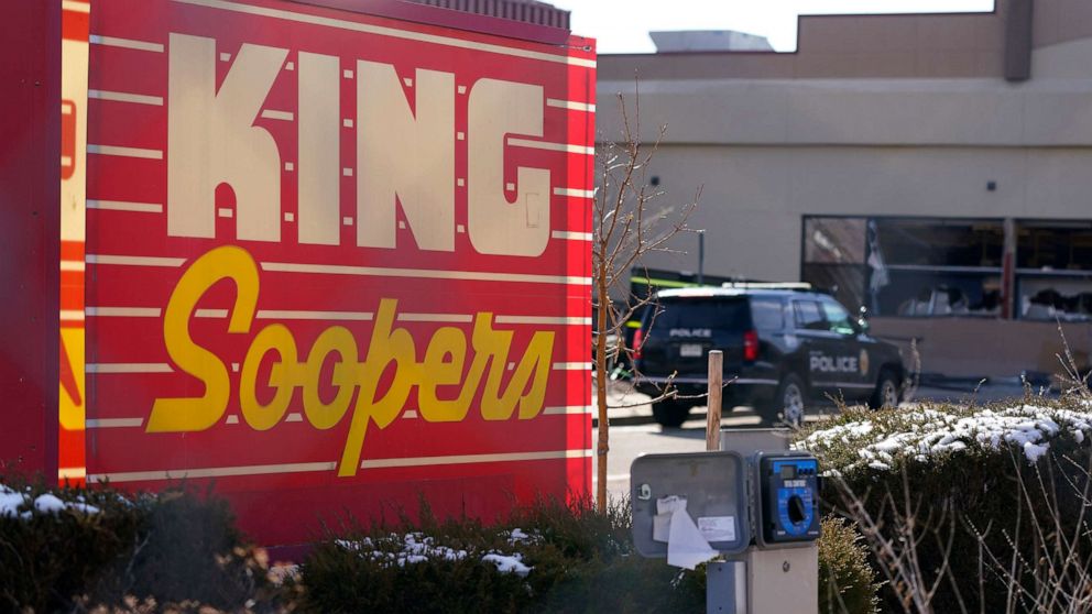 PHOTO: Police vehicles sit in the parking lot outside a King Soopers grocery store where a mass shooting took place, March 23, 2021, in Boulder, Colo.