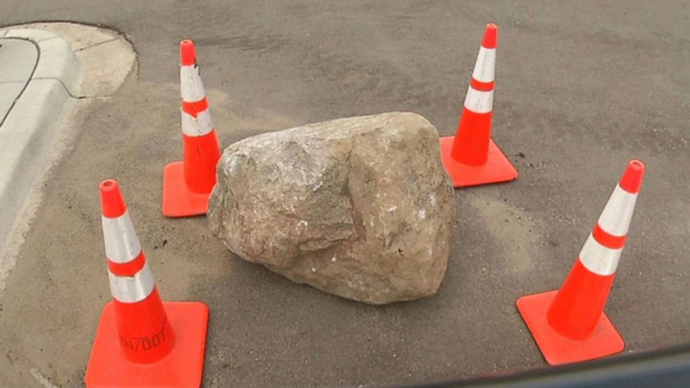 PHOTO: A mother and daughter died when a roughly 800-pound boulder fell off a truck and smashed into their car in Rosemount, Minn., July 9, 2018.