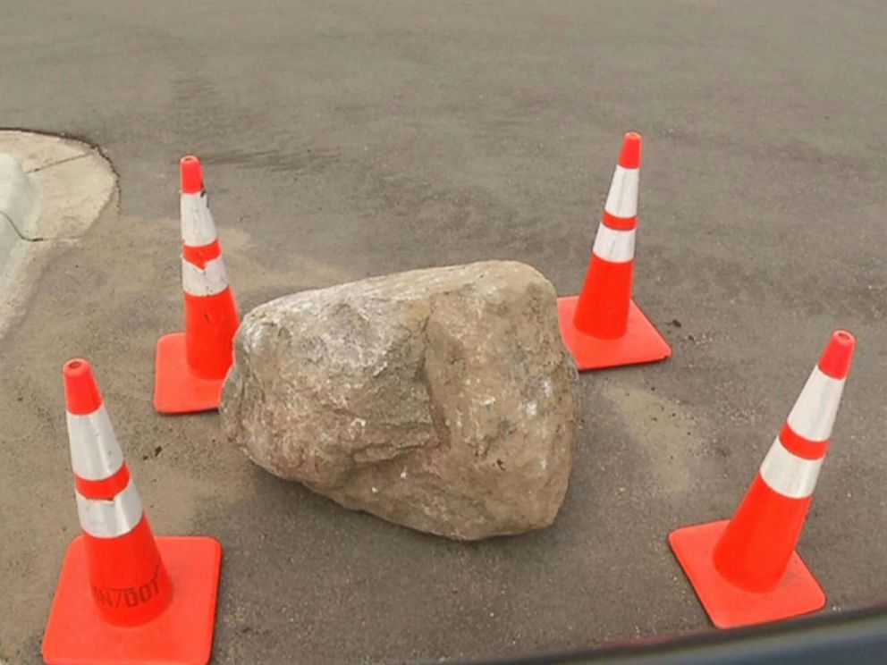 PHOTO: A mother and daughter died when a roughly 800-pound boulder fell off a truck and smashed into their car in Rosemount, Minn., July 9, 2018.