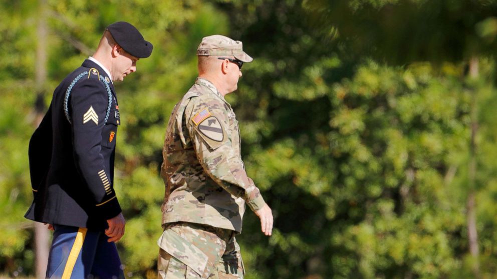 U.S. Army Sergeant Bowe Bergdahl,  left, is escorted out of the courthouse after the sixth day of sentencing proceedings in his court martial at Fort Bragg, North Carolina, Nov. 1, 2017.