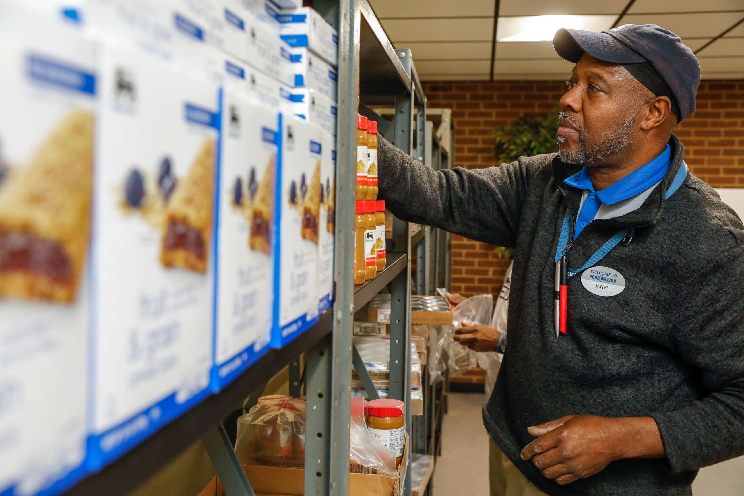 PHOTO: A Food Lion employee stocks shelves in a food pantry located in the student center of Bowie State University in Maryland that features both non-perishable items and fresh produce, Feb. 14, 2020.