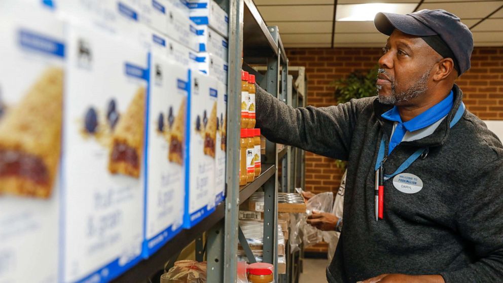 PHOTO: A Food Lion employee stocks shelves in a food pantry located in the student center of Bowie State University in Maryland that features both non-perishable items and fresh produce, Feb. 14, 2020.