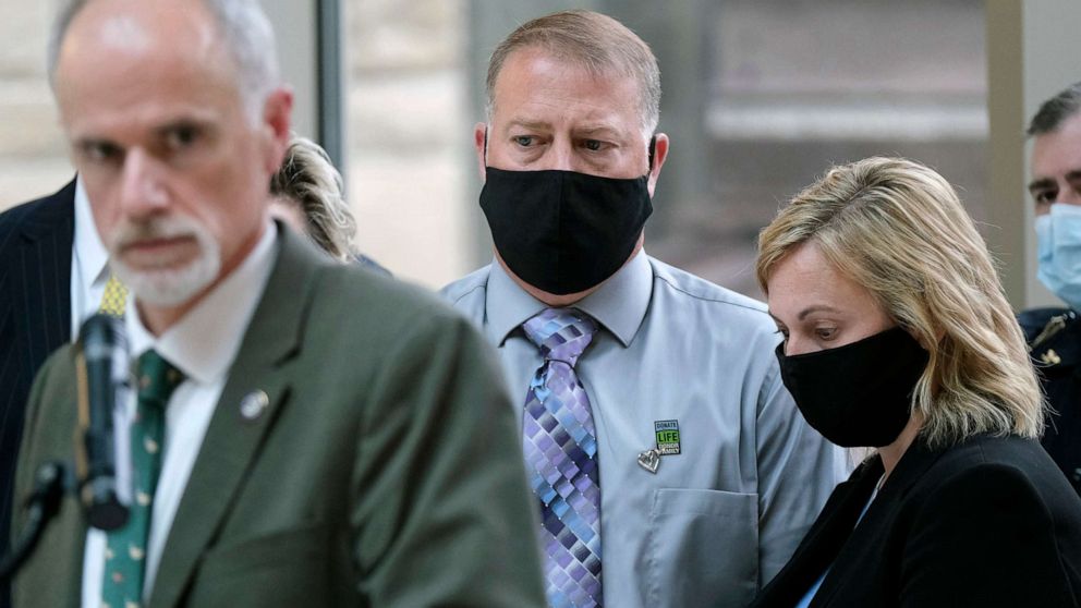 PHOTO: Cory and Shari Foltz, parents of Stone Foltz, a student who died after an alleged hazing incident, look on while Wood County Prosecuting Attorney Paul Dobson, left, takes questions from the media in Bowling Green, Ohio, April 29, 2021. 