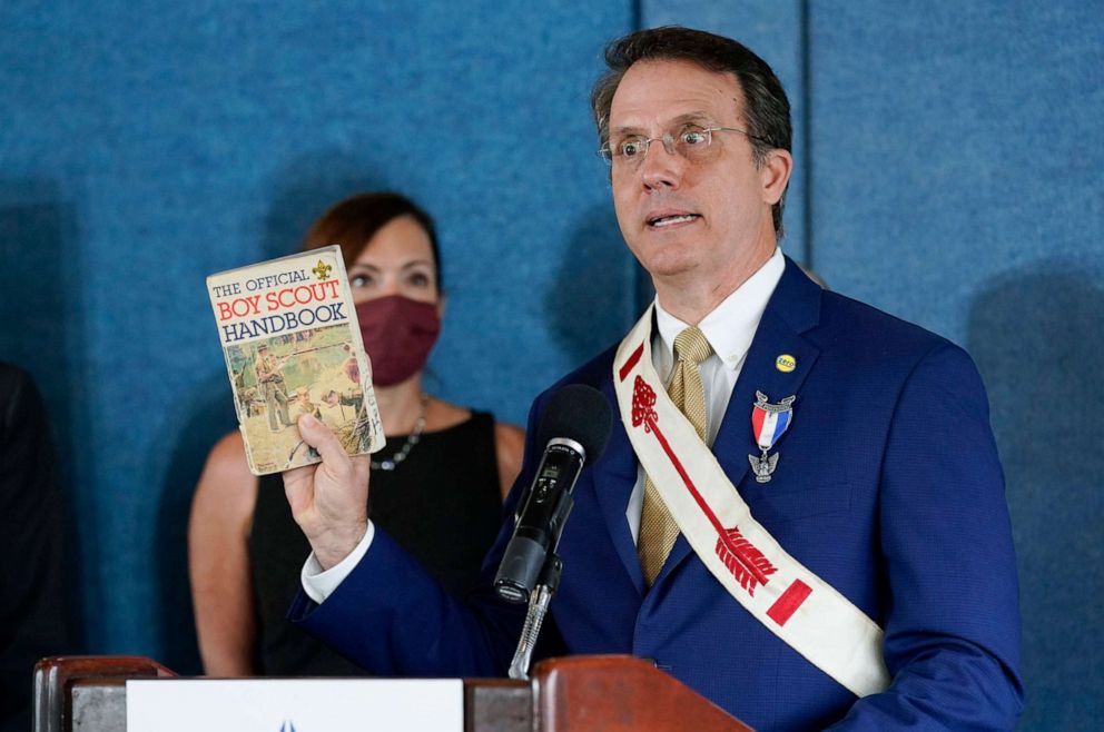 PHOTO: In this Oct. 12, 2021, file photo, Jeff Dion, CEO of the Zero Abuse Project and a sexual abuse survivor, displays his Boy Scout Handbook as he speaks at a news conference at the National Press Club in Washington, D.C.