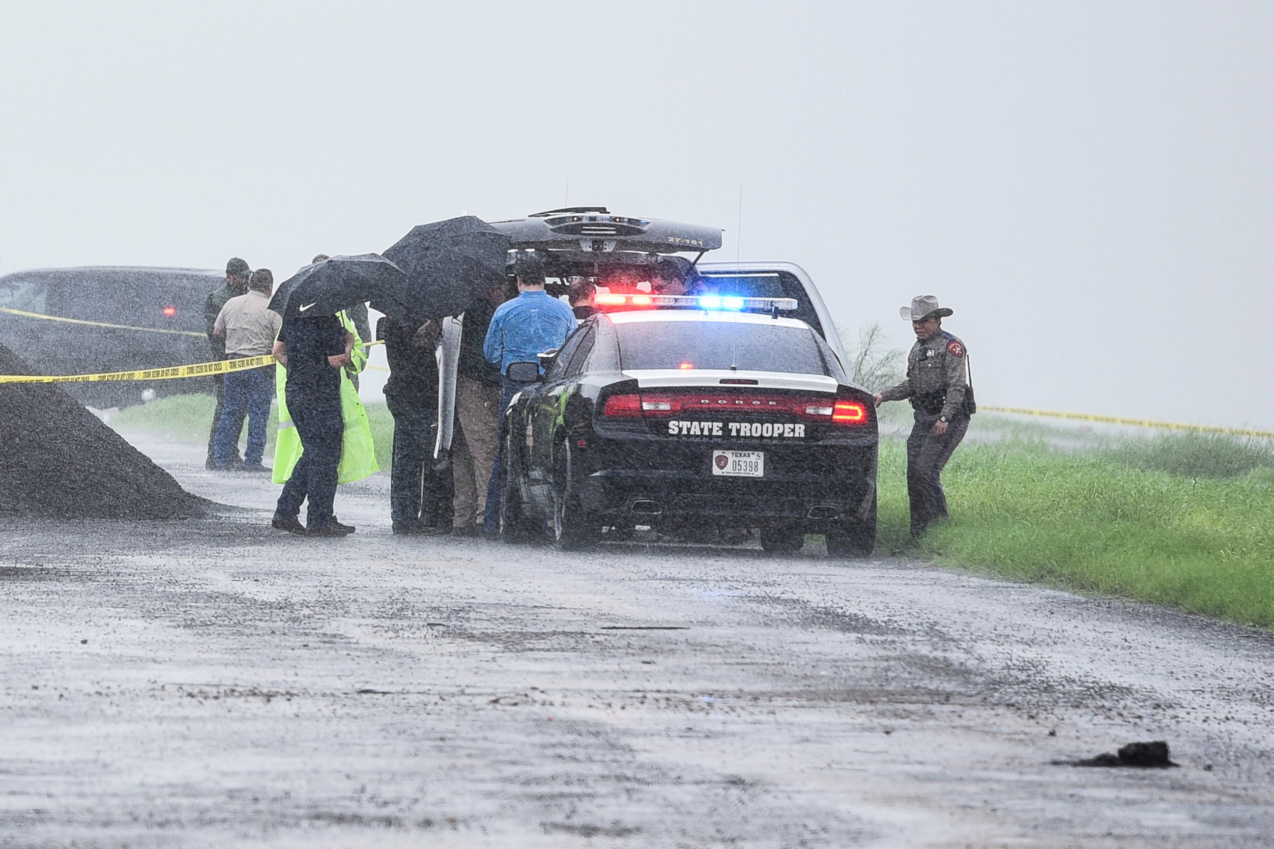 PHOTO: Law enforcement officers gather near the scene where the body of a woman was found near Interstate 35 north of Laredo, Texas on Saturday, Sept. 15, 2018. 