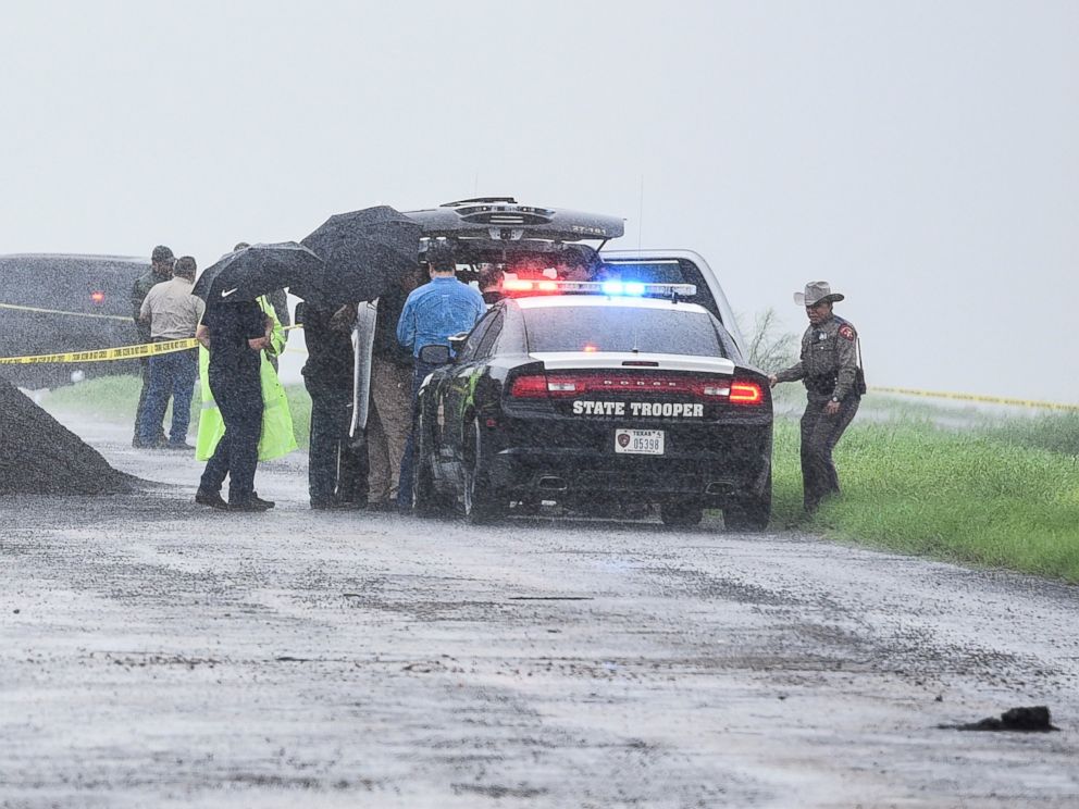 PHOTO: Law enforcement officers gather near the scene where the body of a woman was found near Interstate 35 north of Laredo, Texas on Saturday, Sept. 15, 2018.