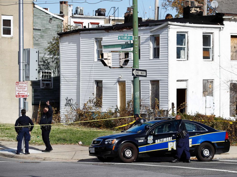 PHOTO:Members of the Baltimore Police Department gather near the scene of the shooting death of Baltimore Police detective Sean Suiter in Baltimore, Nov. 17, 2017.