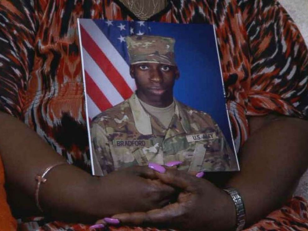 PHOTO: April Pipkins, Emantic Bradford's mother, is holding a photo of her son in an interview following the death of her son during a shootout at a shopping center in Hoover, Alaska on Thanksgiving Day.