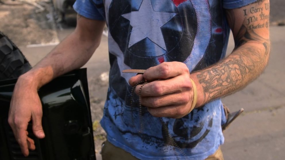 Brady Harvell searched debris of his parents' home for two hours to find his dog tags.