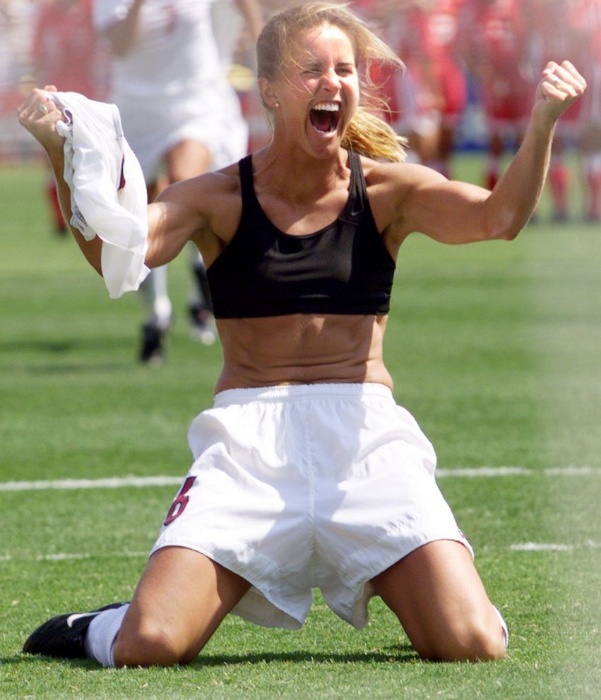 PHOTO: Brandi Chastain of the U.S. shouts after falling on her knees after she scored the last goal in a shoot-out in the finals of the Women's World Cup with China at the Rose Bowl in Pasadena, Calif.,  July 10, 1999. The US won 5-4 on penalties.