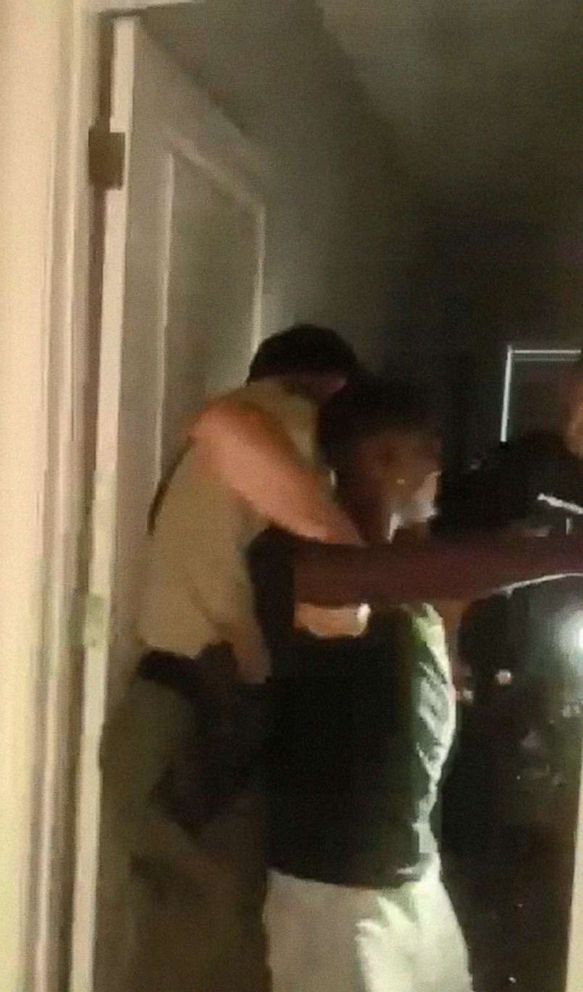 PHOTO: Brandon Calloway is restrained by police in a still image from a video taken by Calloway's girlfriend, Tamia Caldwell, on July 16, 2022, showing the altercation with police that left him injured.