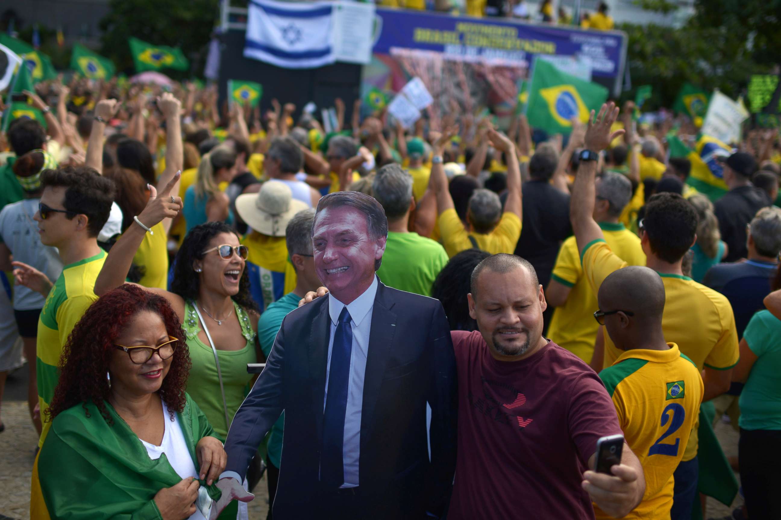PHOTO:A man takes a selfie with a cardboard doll, depicting Brazil's President Jair Bolsonaro during a pro-government demonstration near Copacabana beach in Rio de Janeiro, Brazil, May 26, 2019.