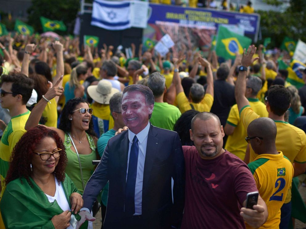 PHOTO:A man takes a selfie with a cardboard doll, depicting Brazils President Jair Bolsonaro during a pro-government demonstration near Copacabana beach in Rio de Janeiro, Brazil, May 26, 2019.