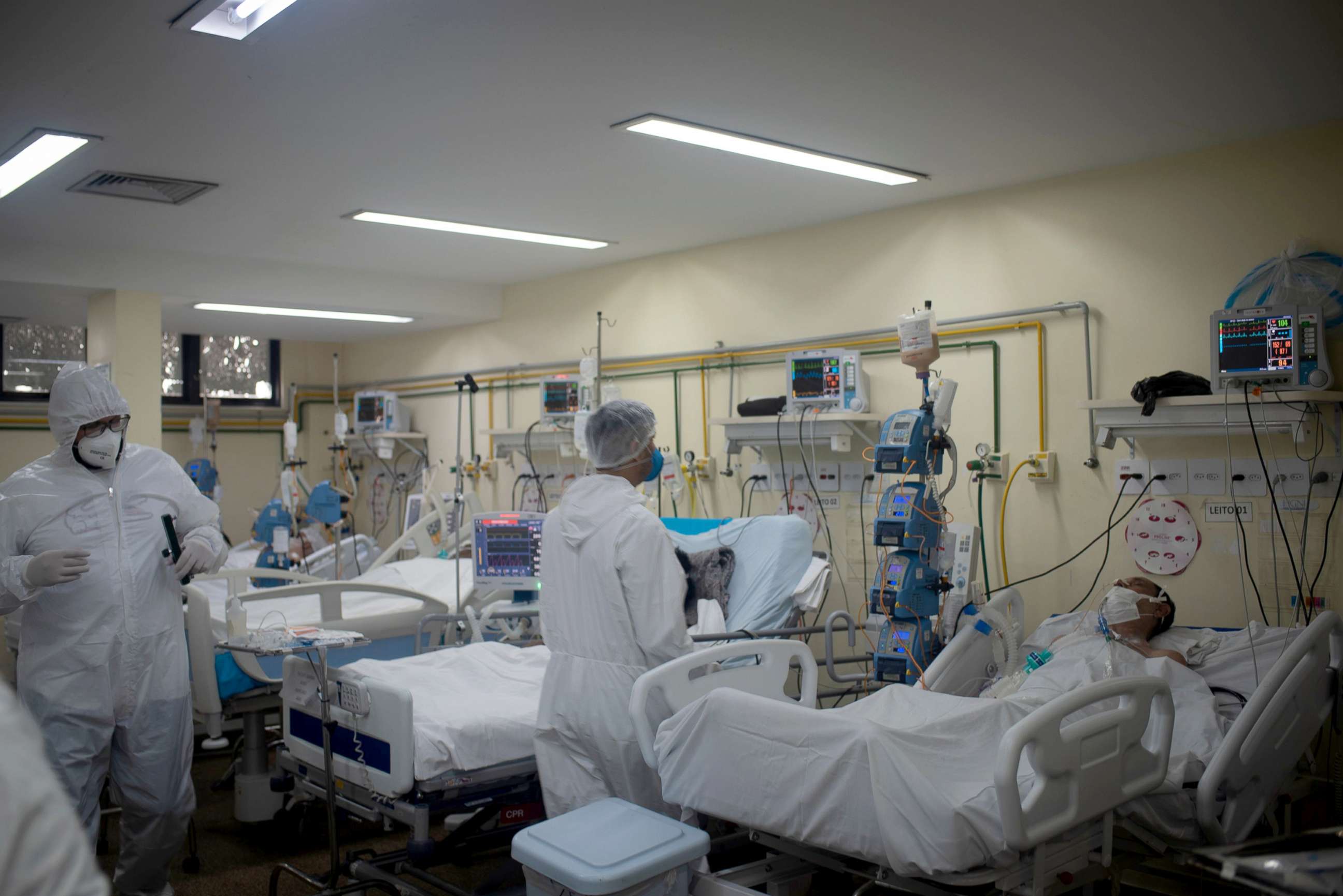 PHOTO: Health workers with their personal protection equipment in the intensive cares area of a hospital in Rio de Janeiro, Brazil, May 27, 2021. 