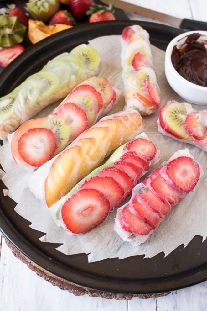 PHOTO: Dip fruit salad sushi rolls in chocolate sauce.