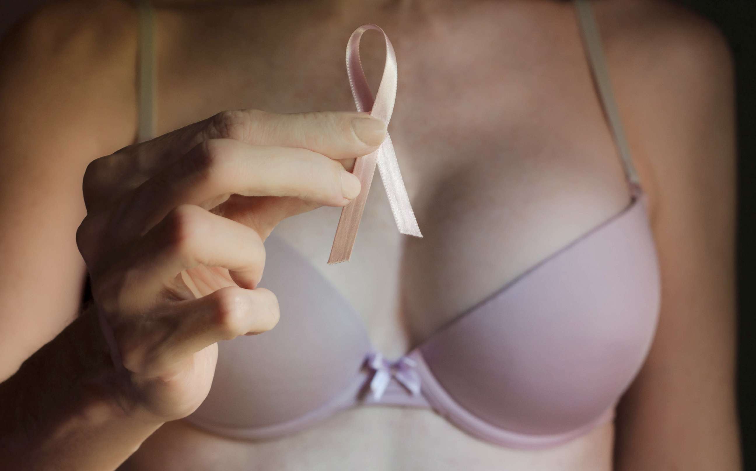 PHOTO: A woman holds a breast cancer awareness ribbon in this undated stock photo.