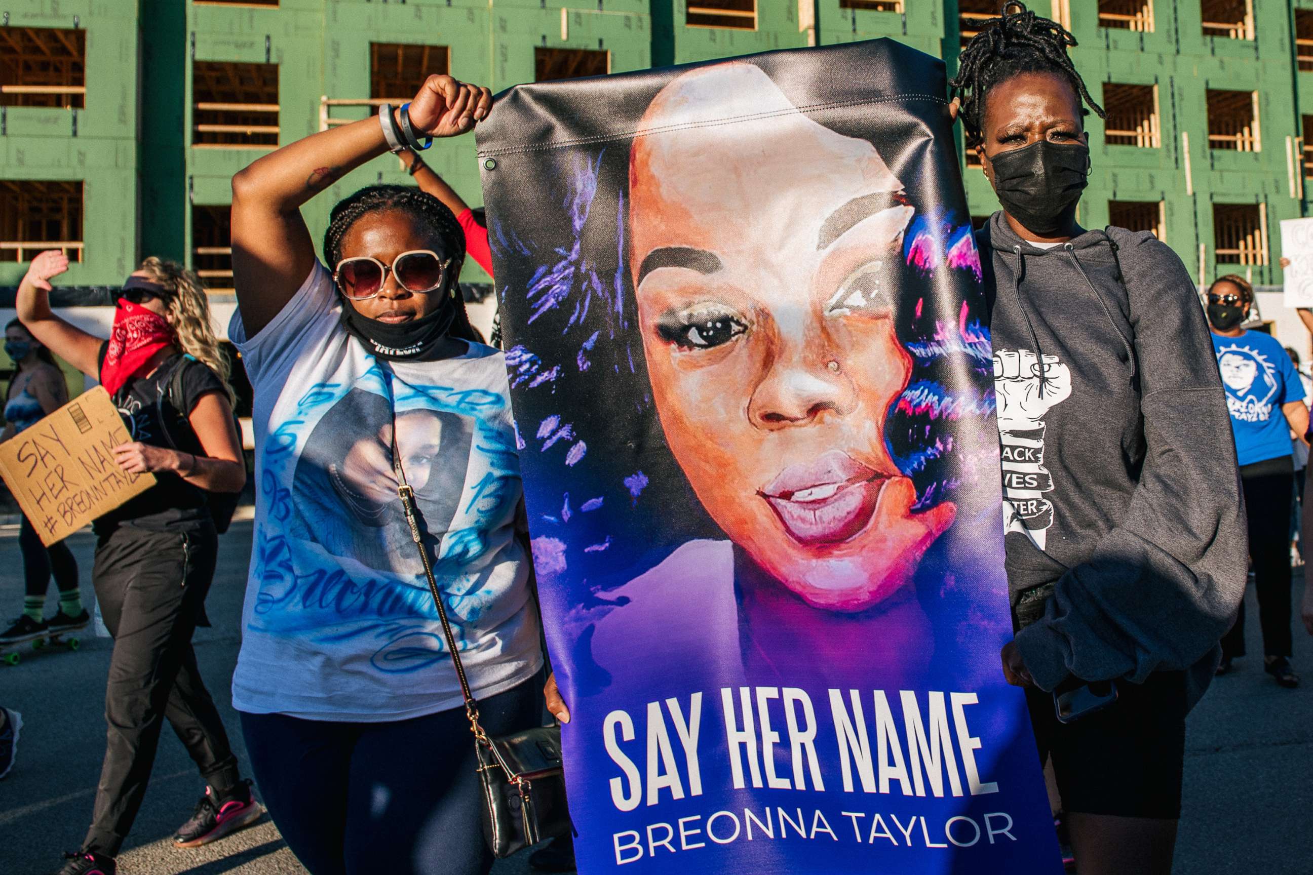PHOTO: Two women hold a sign of Breonna Taylor during a rally on Sept. 18, 2020, in Louisville, Ky.