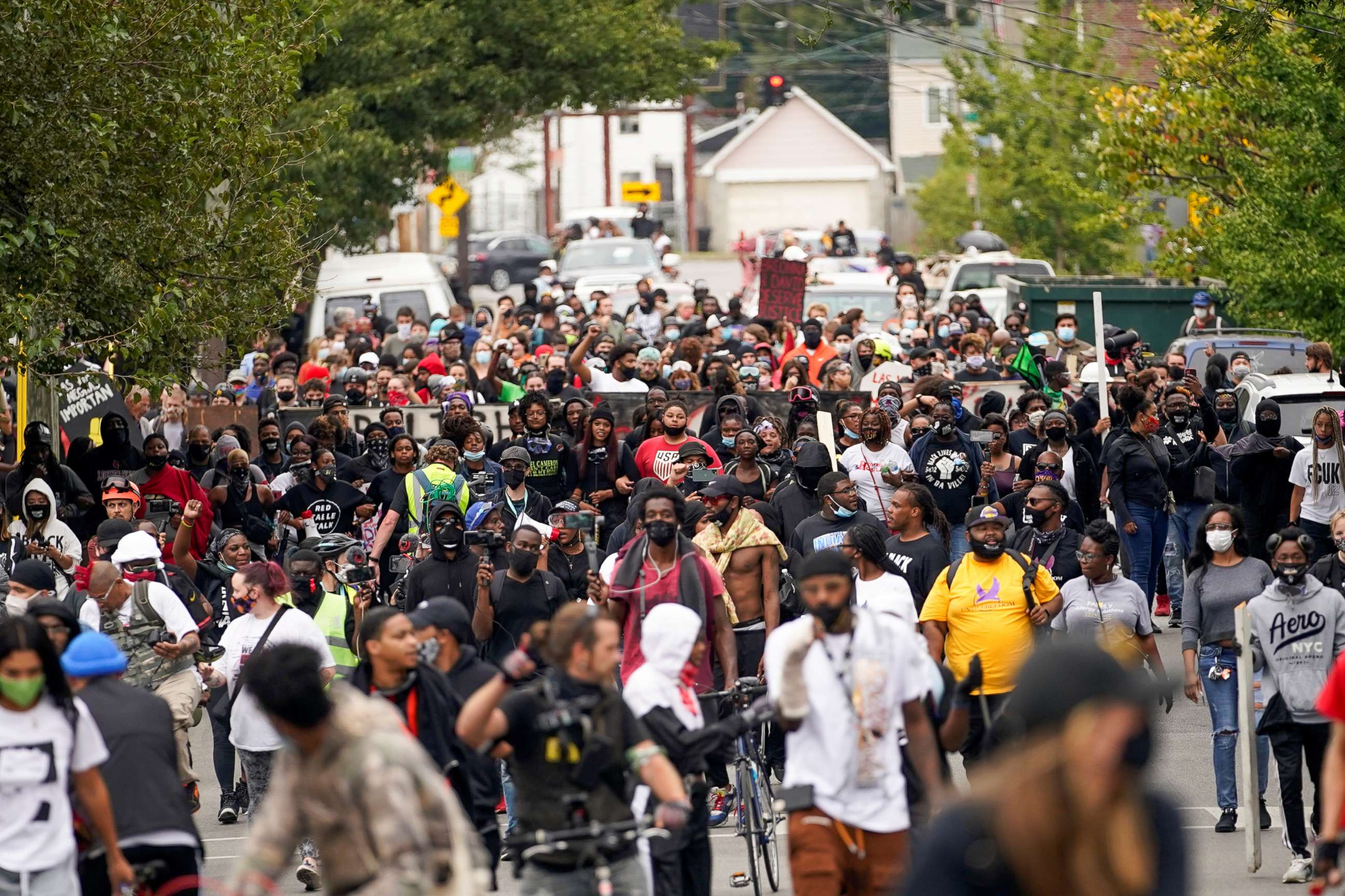 PHOTO: People react after a decision in the criminal case against police officers involved in the death of Breonna Taylor, who was shot dead by police in her apartment, in Louisville, Ky., Sept. 23, 2020.