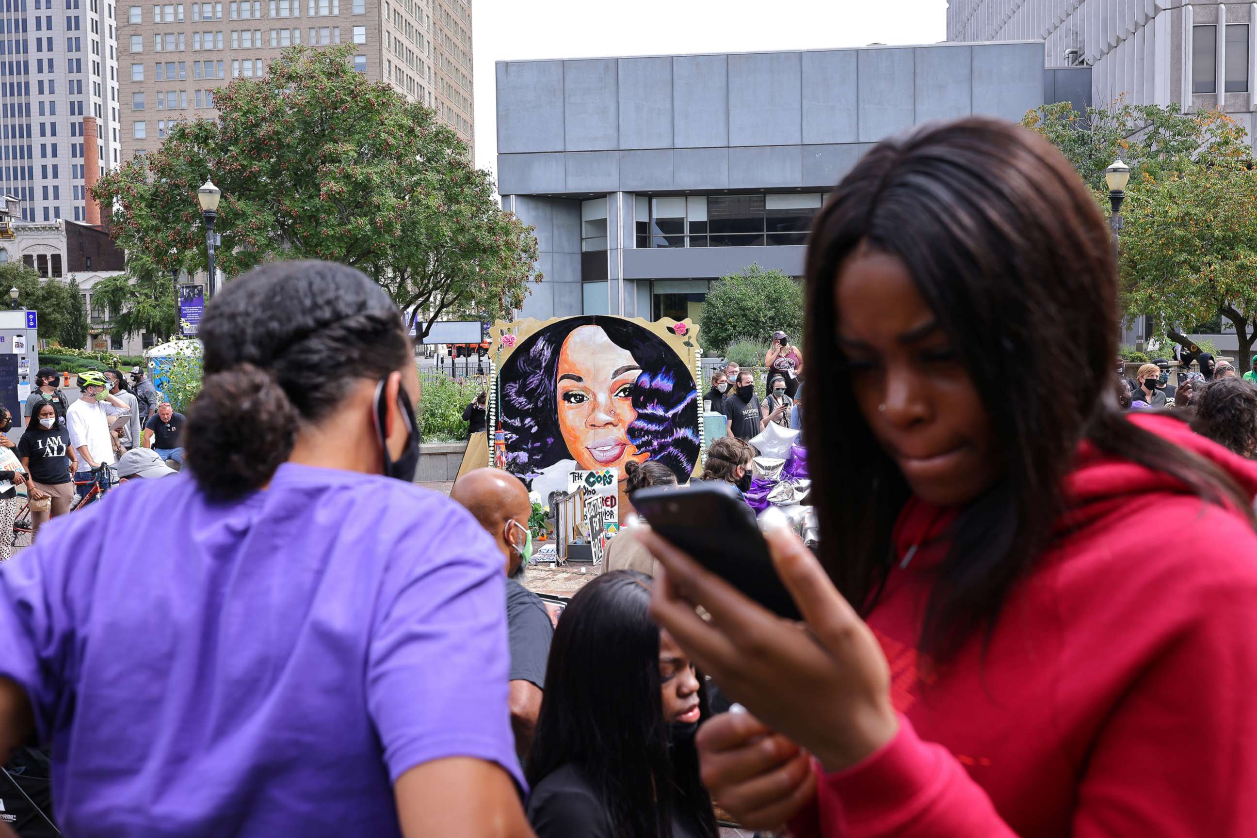 PHOTO: People wait for the decision in the criminal case against police officers involved in the death of Breonna Taylor, who was shot dead by police in her apartment, in Louisville, Ky., Sept. 23, 2020.