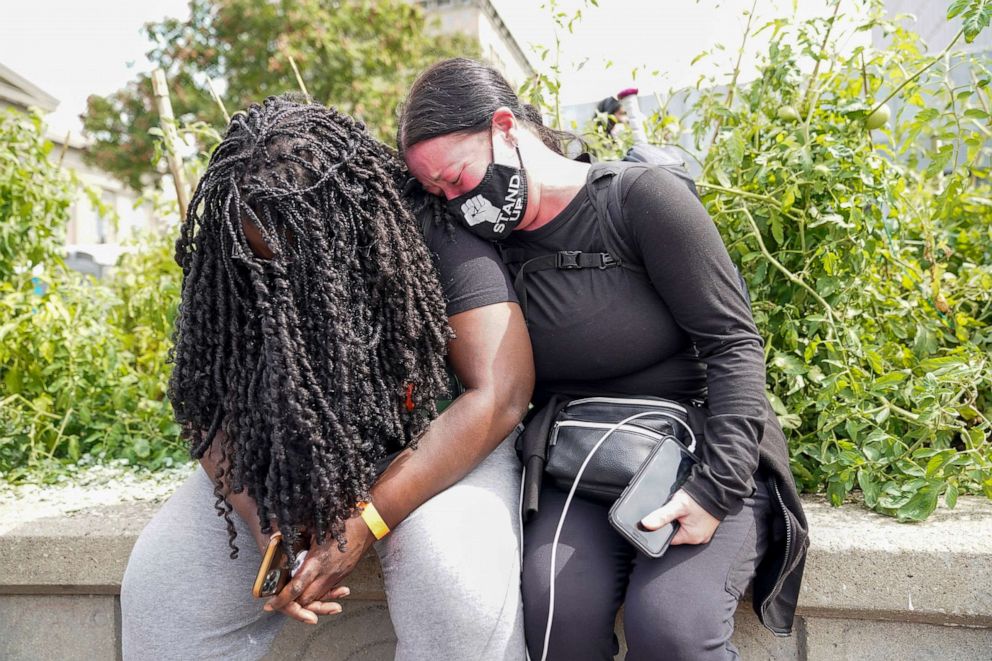 PHOTO: People react after a decision in the criminal case against police officers involved in the death of Breonna Taylor, who was shot dead by police in her apartment, in Louisville, Ky., Sept. 23, 2020.