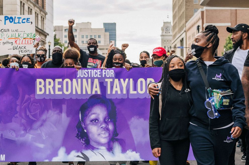 PHOTO: Activists carry a banner with an image of Breonna Taylor during a demonstration on Sept. 25, 2020 in Louisville, Ky.