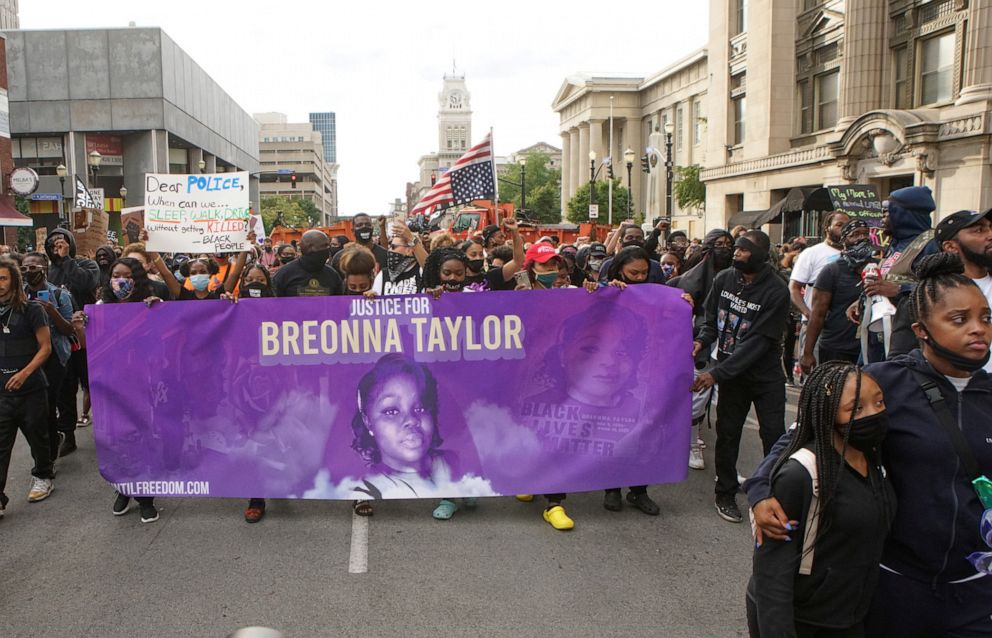 PHOTO: Protesters march through downtown Louisville after a grand jury decided not to bring homicide charges against police officers involved in the fatal shooting of Breonna Taylor, in Louisville, Ky., Sept. 25, 2020.