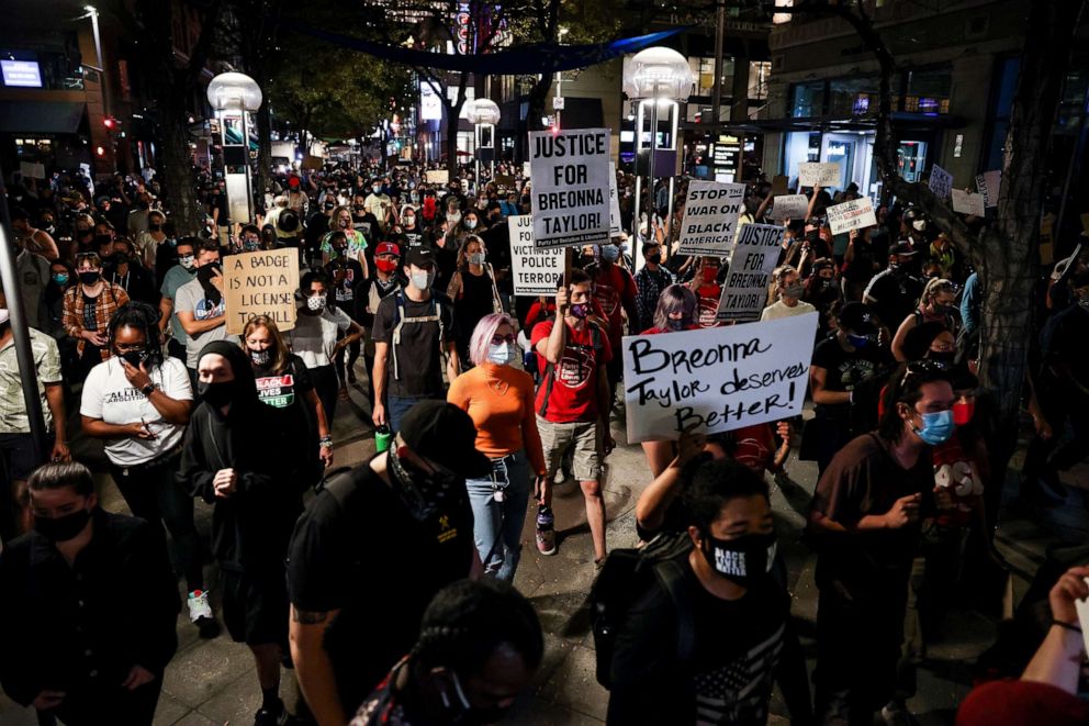 PHOTO: People march down the 16th Street Mall as they protest the grand jury decision in the Breonna Taylor case, Sept. 23, 2020, in Denver, Colorado.