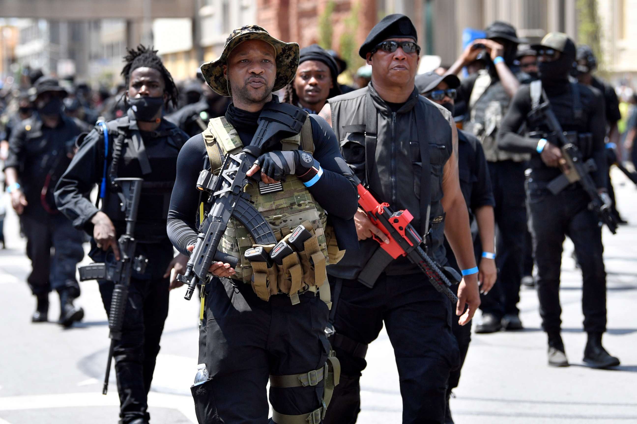 PHOTO: Armed members of the "NAFC" march through downtown toward the Hall of Justice in Louisville, Ky., Saturday, July 25, 2020.