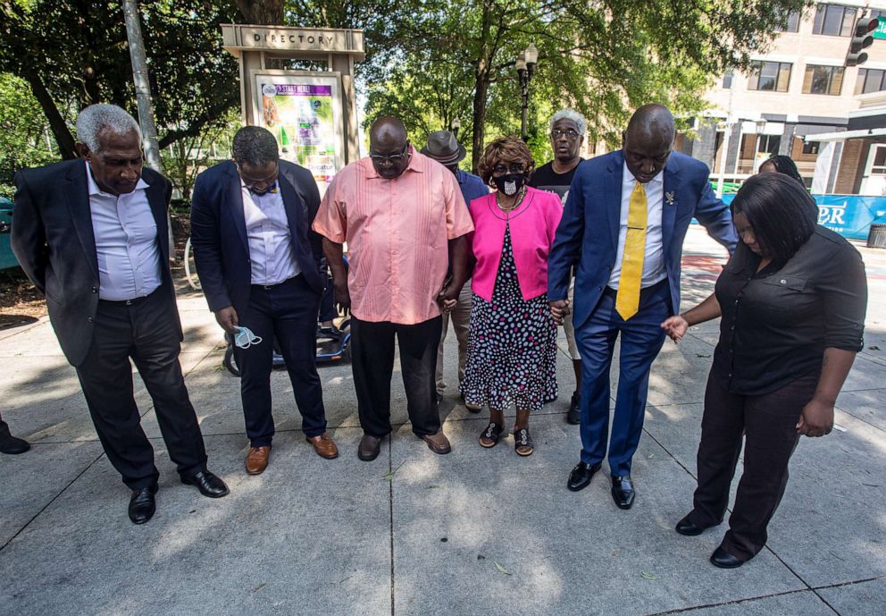 PHOTO: Attorney Ben Crump, second from right, joins in prayer with the family of Brianna Grier on July 29, 2022, in Decatur, Ga.