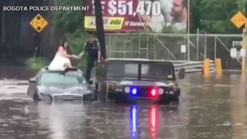 VIDEO: Bride, groom rescued from flooded car 