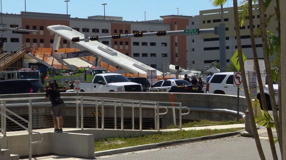 PHOTO: This AFP TV video frame grab shows a newly installed pedestrian bridge over a six-lane highway in Miami on the Florida International University in Miami, March 15, 2018, crushing a number of cars below.