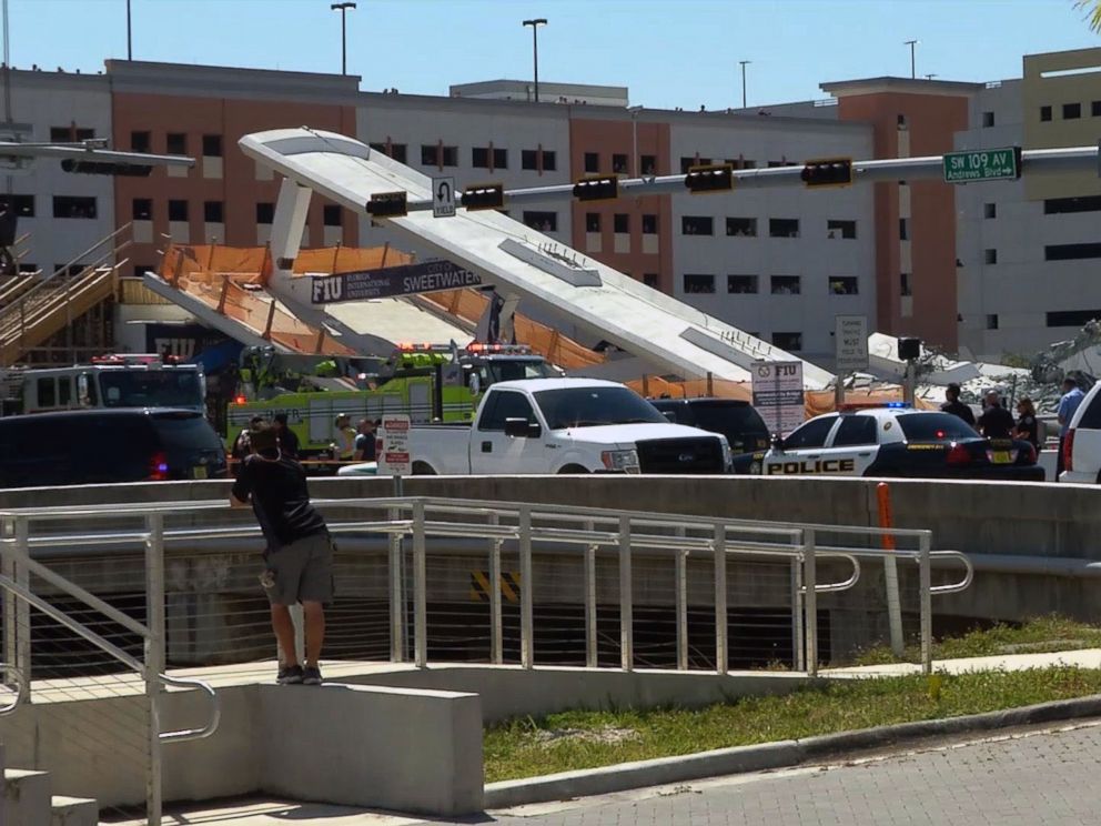 PHOTO: This AFP TV video frame grab shows a newly installed pedestrian bridge over a six-lane highway in Miami on the Florida International University in Miami, March 15, 2018, crushing a number of cars below.