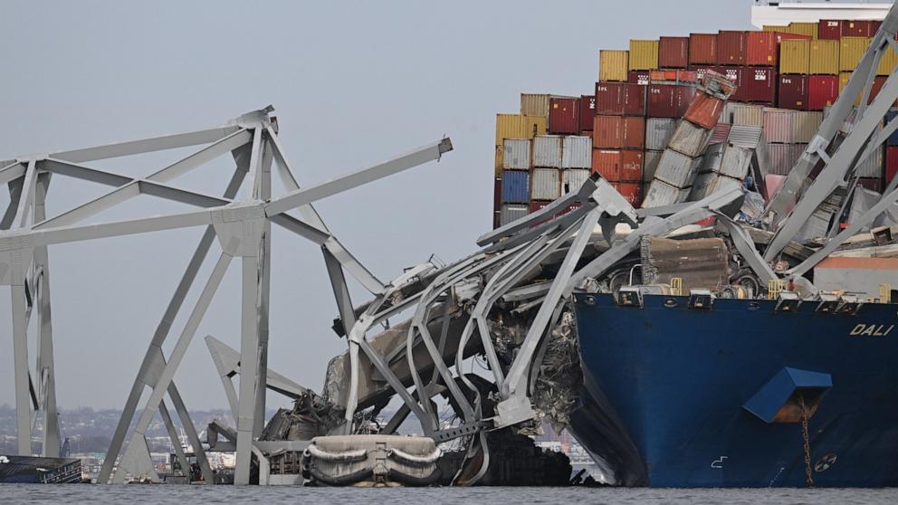 PHOTO: The steel frame of the Francis Scott Key Bridge sits on top of the container ship Dali after the bridge collapsed, Baltimore, March 26, 2024.