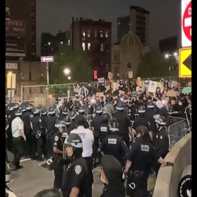 Police in riot gear arrested protesters on New York's Manhattan Bridge.