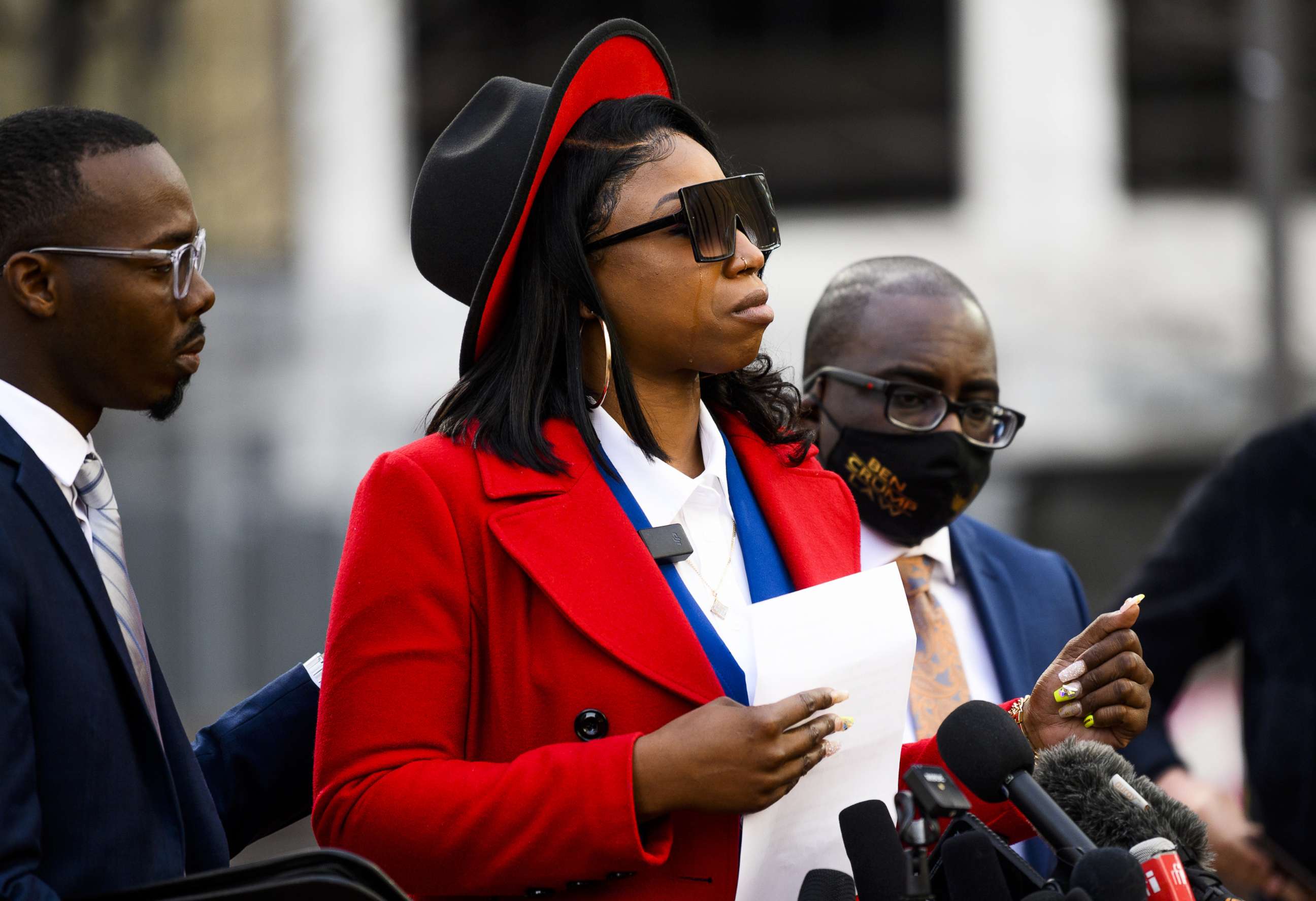PHOTO: A tear rolls down the cheek of Bridgett Floyd, the sister of George Floyd, as she speaks during a press conference outside the Hennepin County Government Center on March 8, 2021, in Minneapolis.