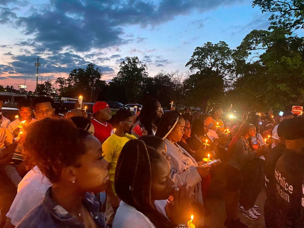 PHOTO: People gather near Interstate 75 and McNichols in Detroit, June 19, 2021, for a vigil to memorialize Brison Christian, the two-year-old boy who was shot near that location. 
