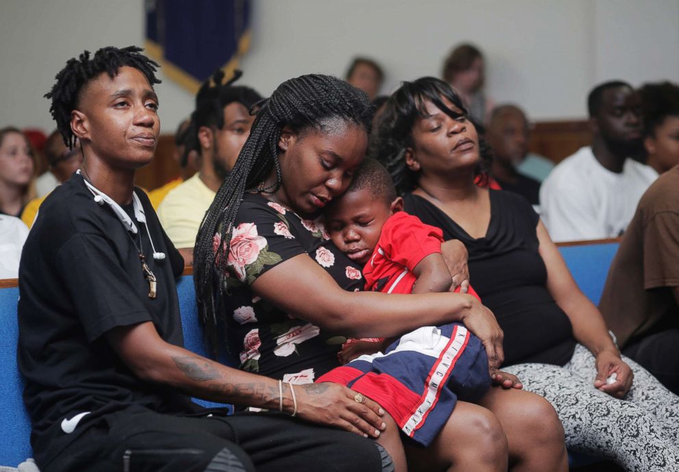 PHOTO: Britany Jacobs, 25, her 5-year-old son Markeis McGlockton Jr., and their cousin Mesha Gilbert, 26, during a vigil for Markeis McGlockton Sr., 28, at Mt. Carmel Baptist Church in Clearwater, Fla., July 22, 2018.